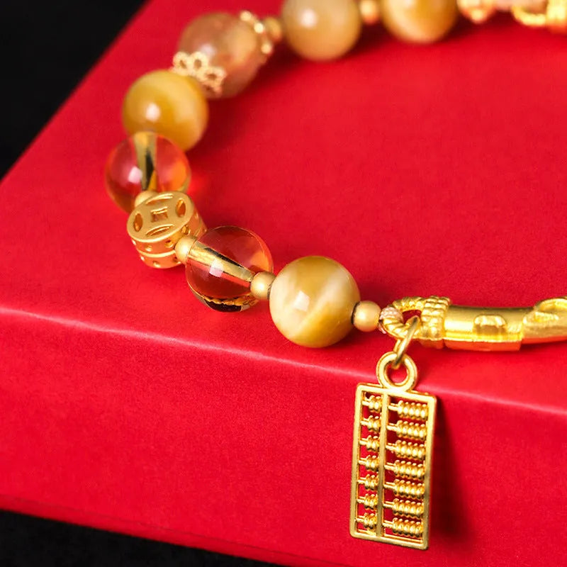 Women's tigereye and citrine abacus bracelet with diamond-shaped design and copper fastenings