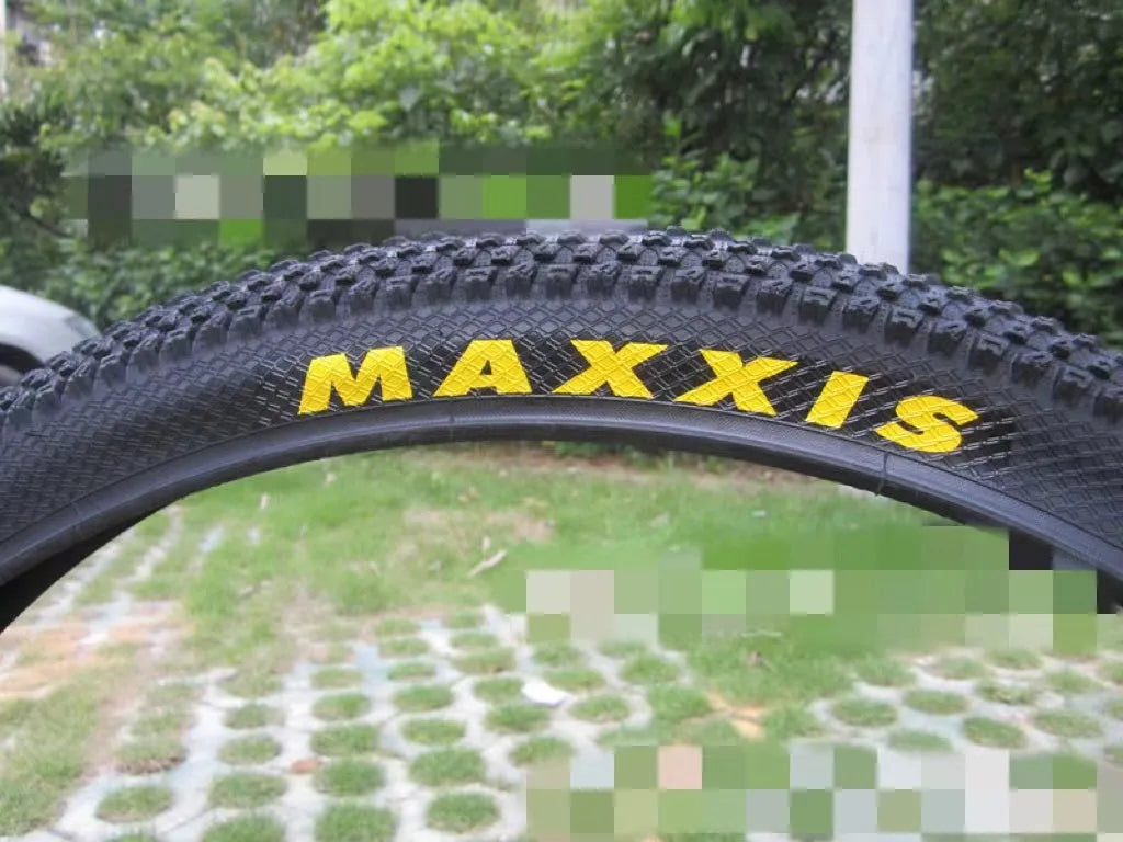 Ultralight puncture-proof mountain bike tyre showing tread and available size options: 26, 27.5, 29 inch.
