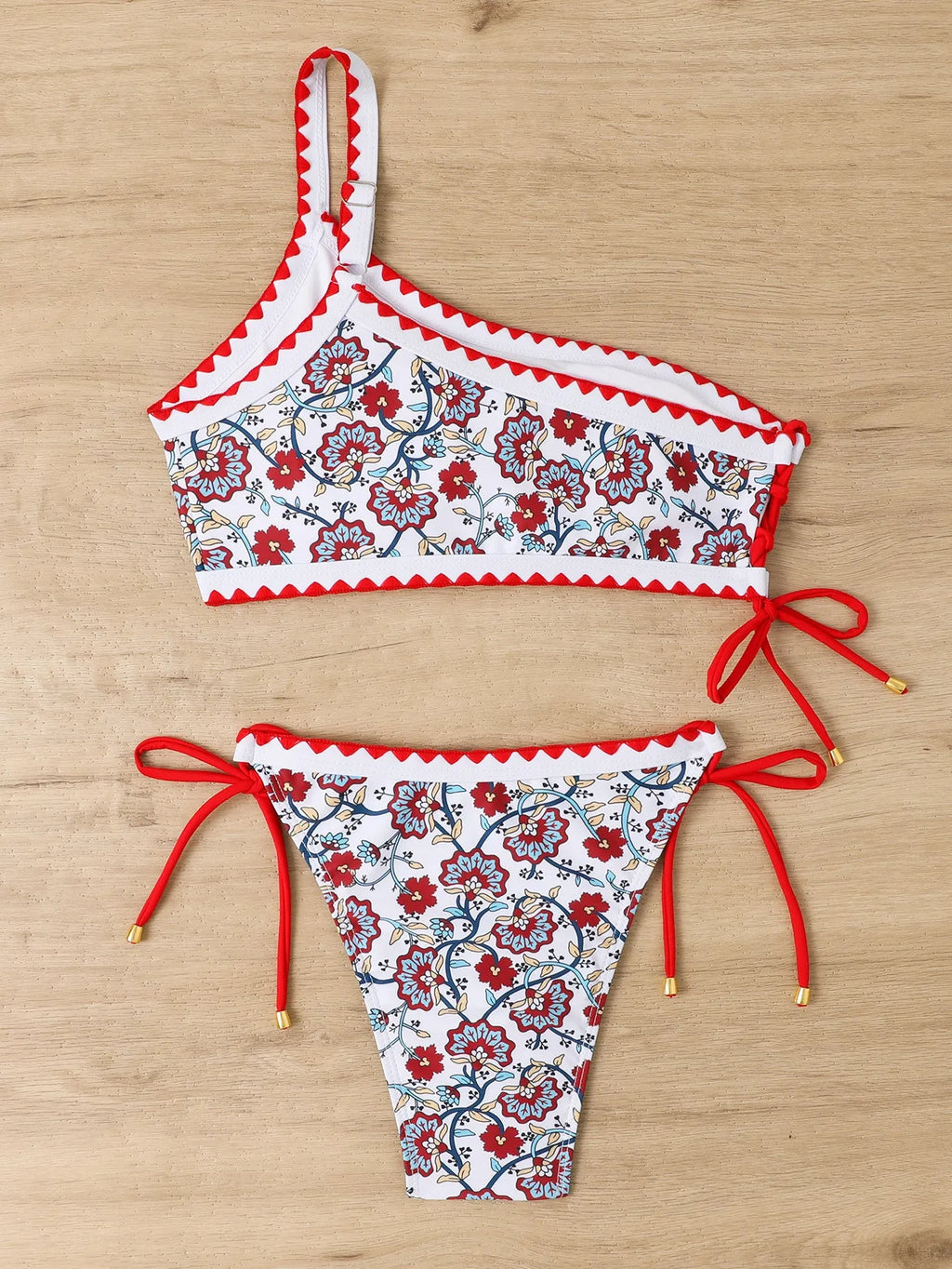 Blue one-shoulder floral bikini set for women on a mannequin
