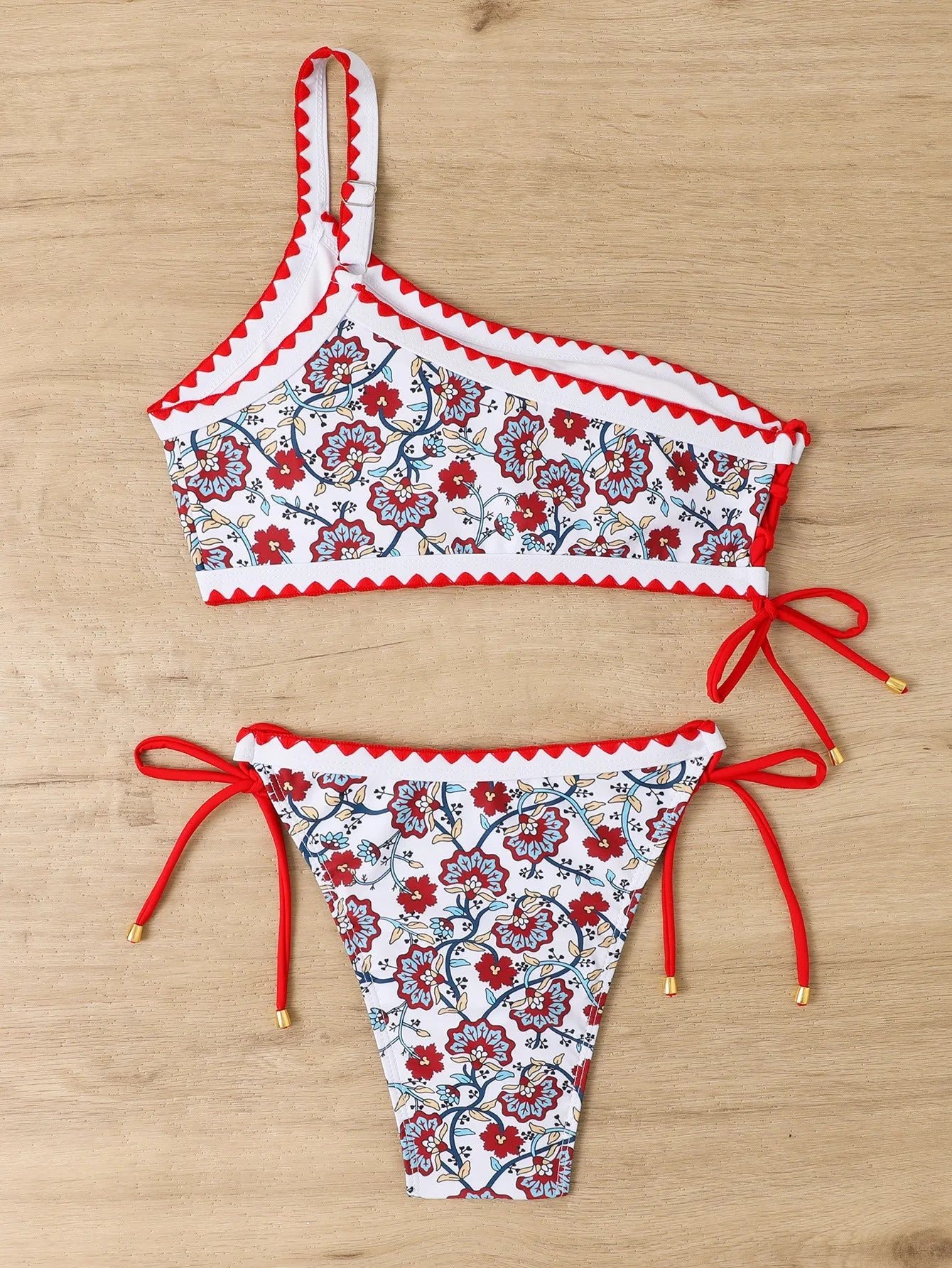 Blue one-shoulder floral bikini set for women on a mannequin