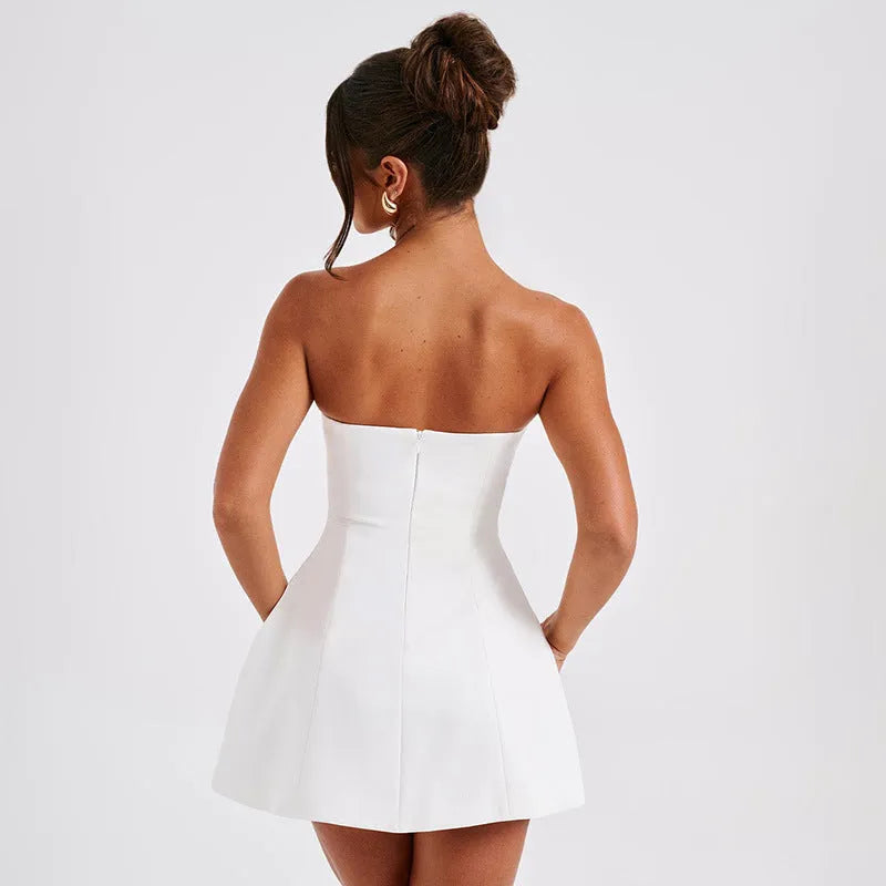 Women's backless tube dress with A-line skirt in solid colour options including black, white, red, and pink