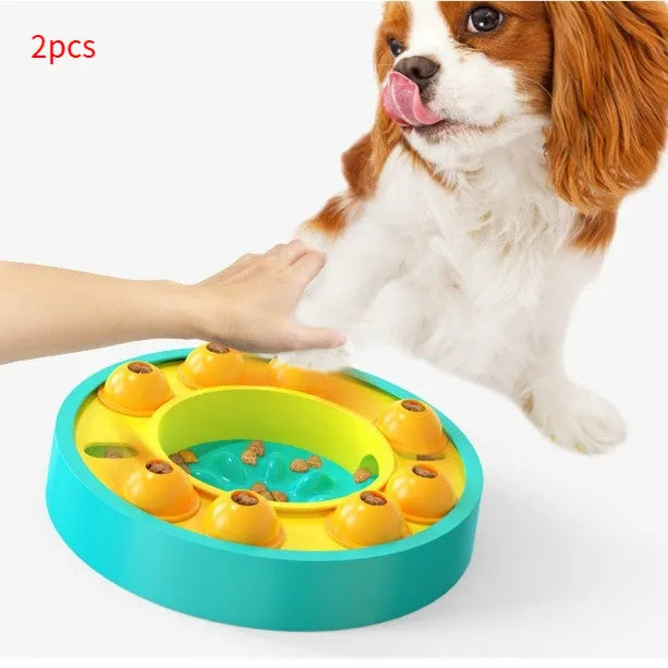 Round blue interactive dog slow feeder puzzle toy with central column and food turntable on a table