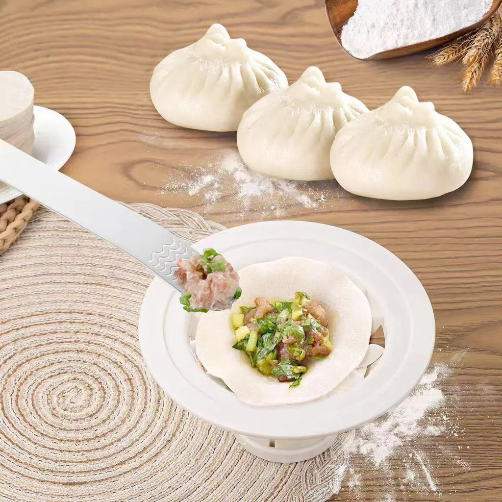 Set of four black stainless steel bun and dumpling moulds for shaping baozi.