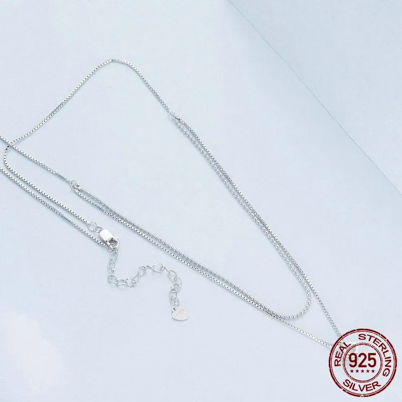 S925 sterling silver double layer necklace with pearl chain and silver alloy pendant.