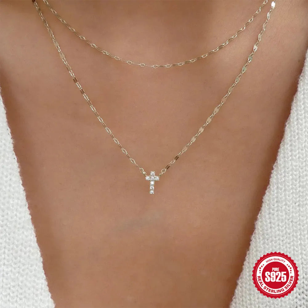 S925 sterling silver double layer twin diamond cross pendant necklace on a clavicle chain in gold or white gold finish.