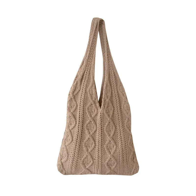 Retro hollow knitted woolen women's shoulder tote bag in a solid colour, showing double straps and large capacity.