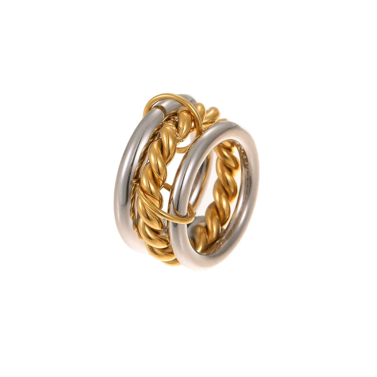 Stacked gold plated stainless steel ring set for women in an exaggerated style on a hand.