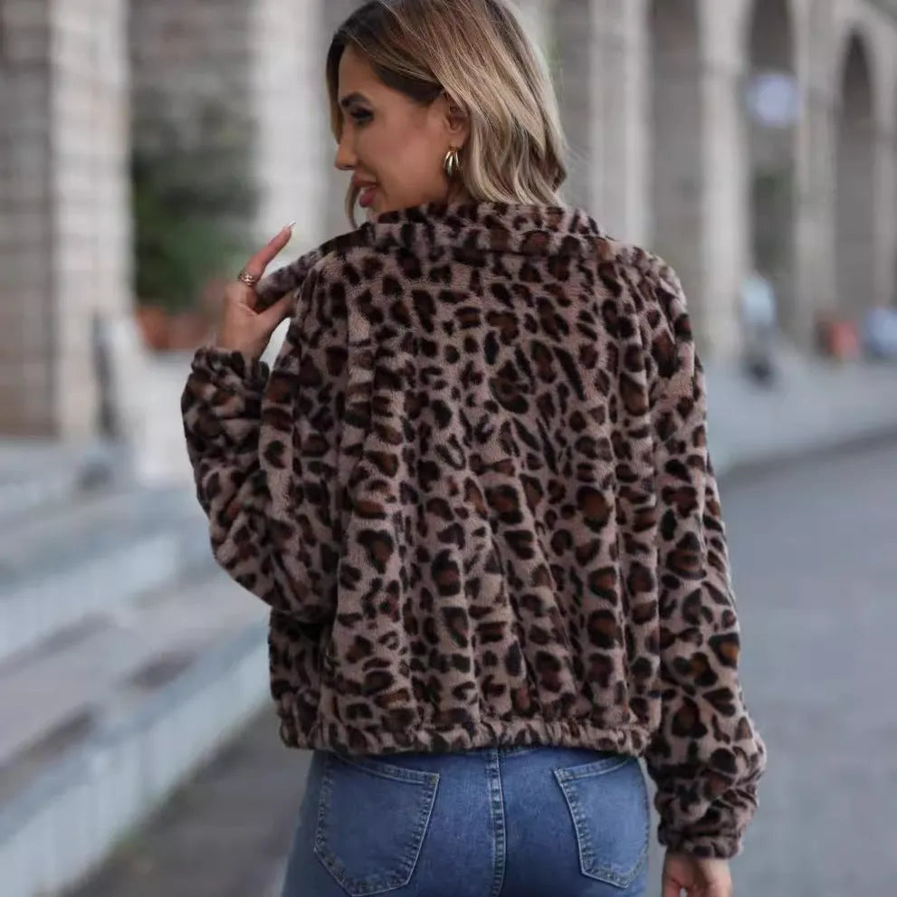 Women's loose leopard print plush coat with zip front and raglan sleeves.
