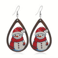 Wooden Christmas earrings with printed geometric designs featuring Christmas tree and snowman patterns