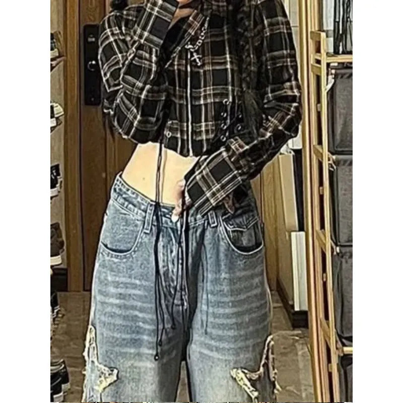 Blue high-waisted wide-leg cotton denim jeans laid flat.