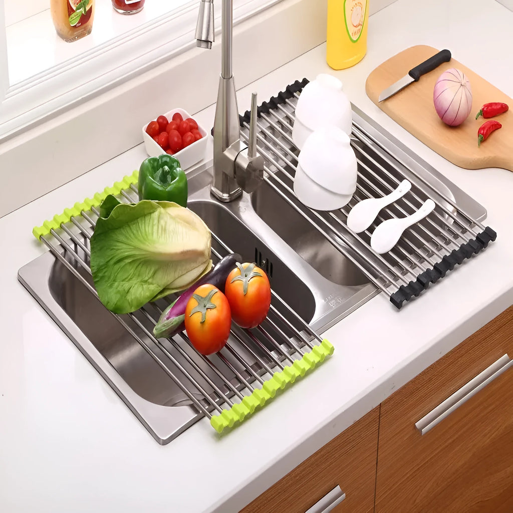Stainless steel folding kitchen drain rack with plastic tubes in a kitchen sink