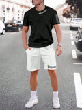 Man wearing a blue printed sports-style short-sleeve top and matching shorts set.