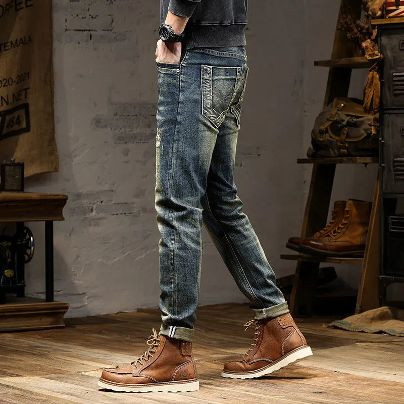 Men's skinny fit jeans in a retro blue wash with a zip fly closure.