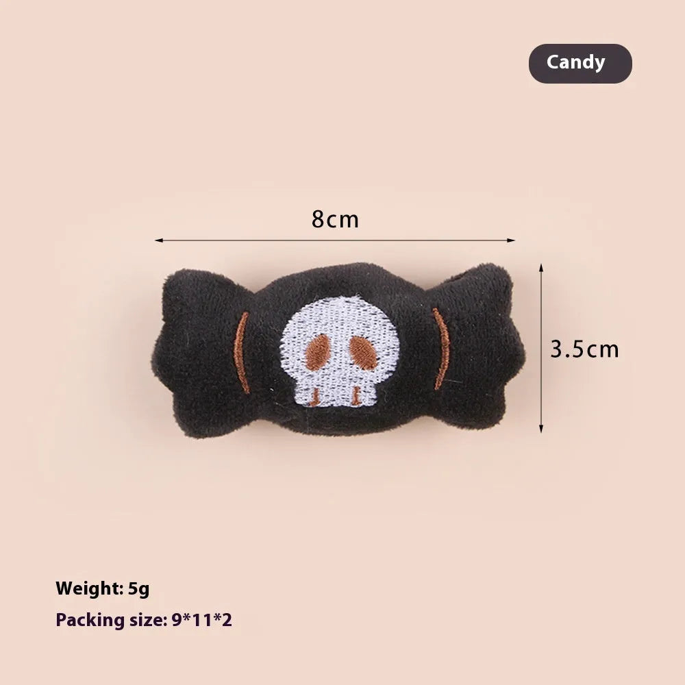Plush cat teaser toy with feather wand in candy or skull design for small cats