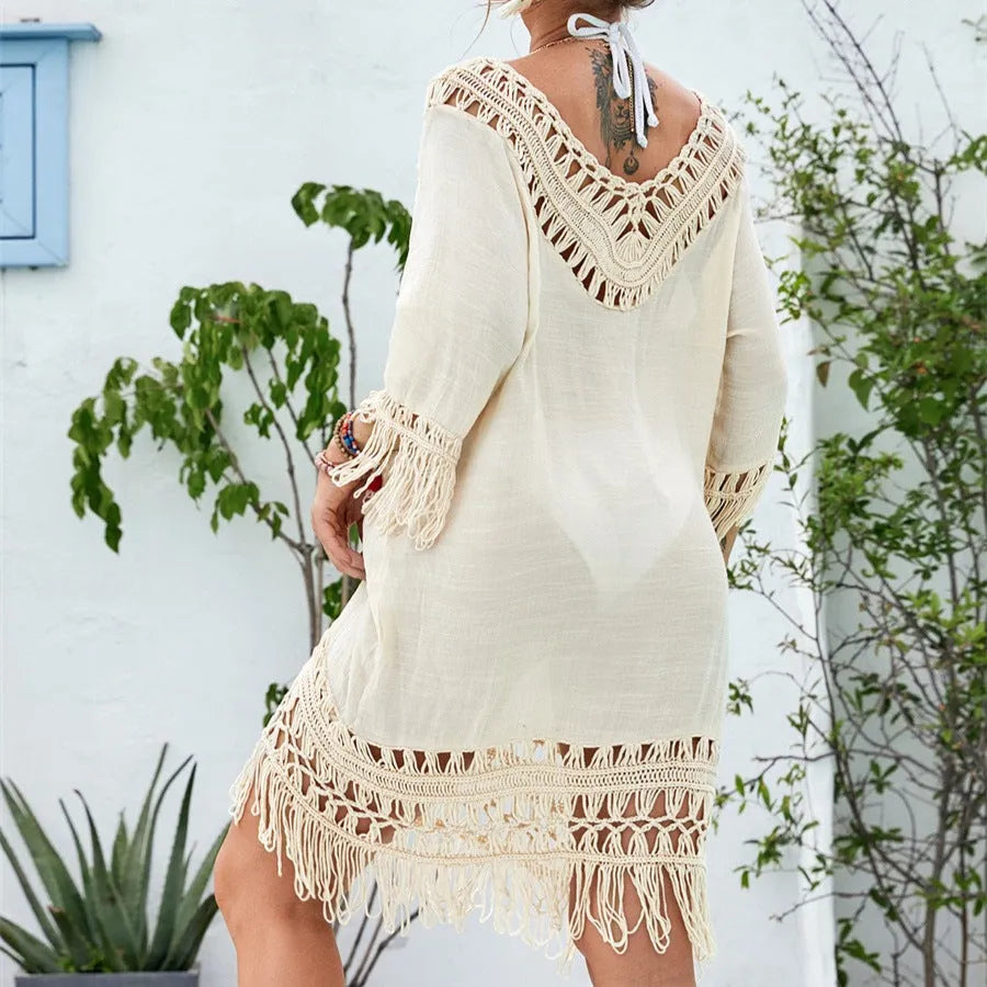 Women's apricot crochet patchwork beach dress with half sleeves, shown on a hanger.