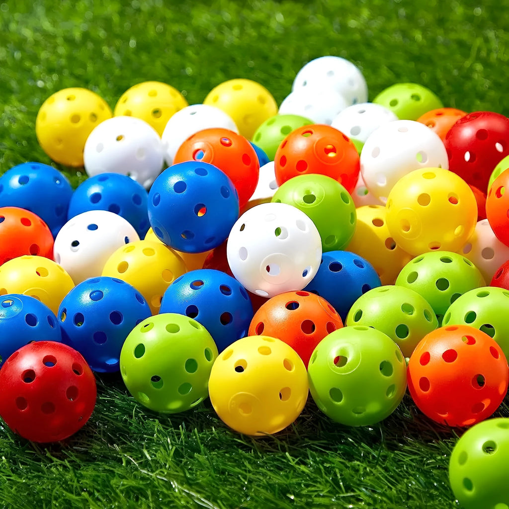Multi-colour 26-hole golf practice balls in red, orange, blue, green, white, and yellow, displayed in a net bag.