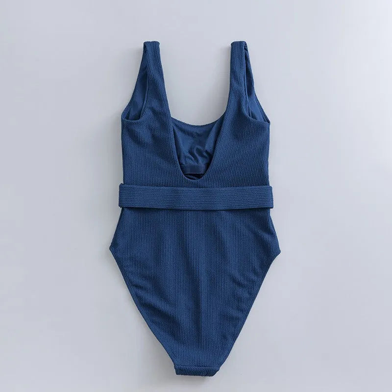 Navy blue women's one-piece swimsuit with triangle slimming design and removable chest pads