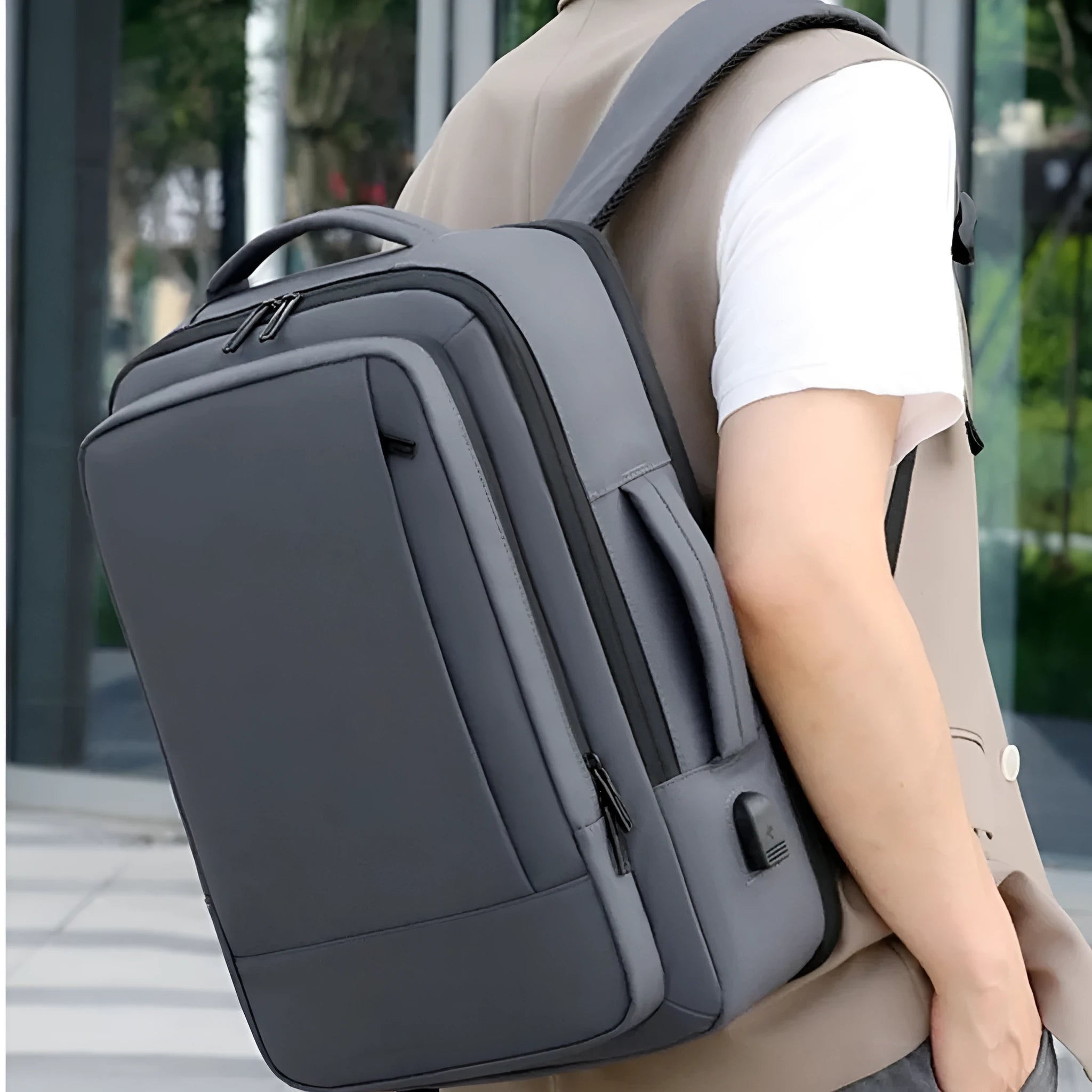 Black waterproof Oxford cloth backpack with Derm leather details and curved shoulder strap
