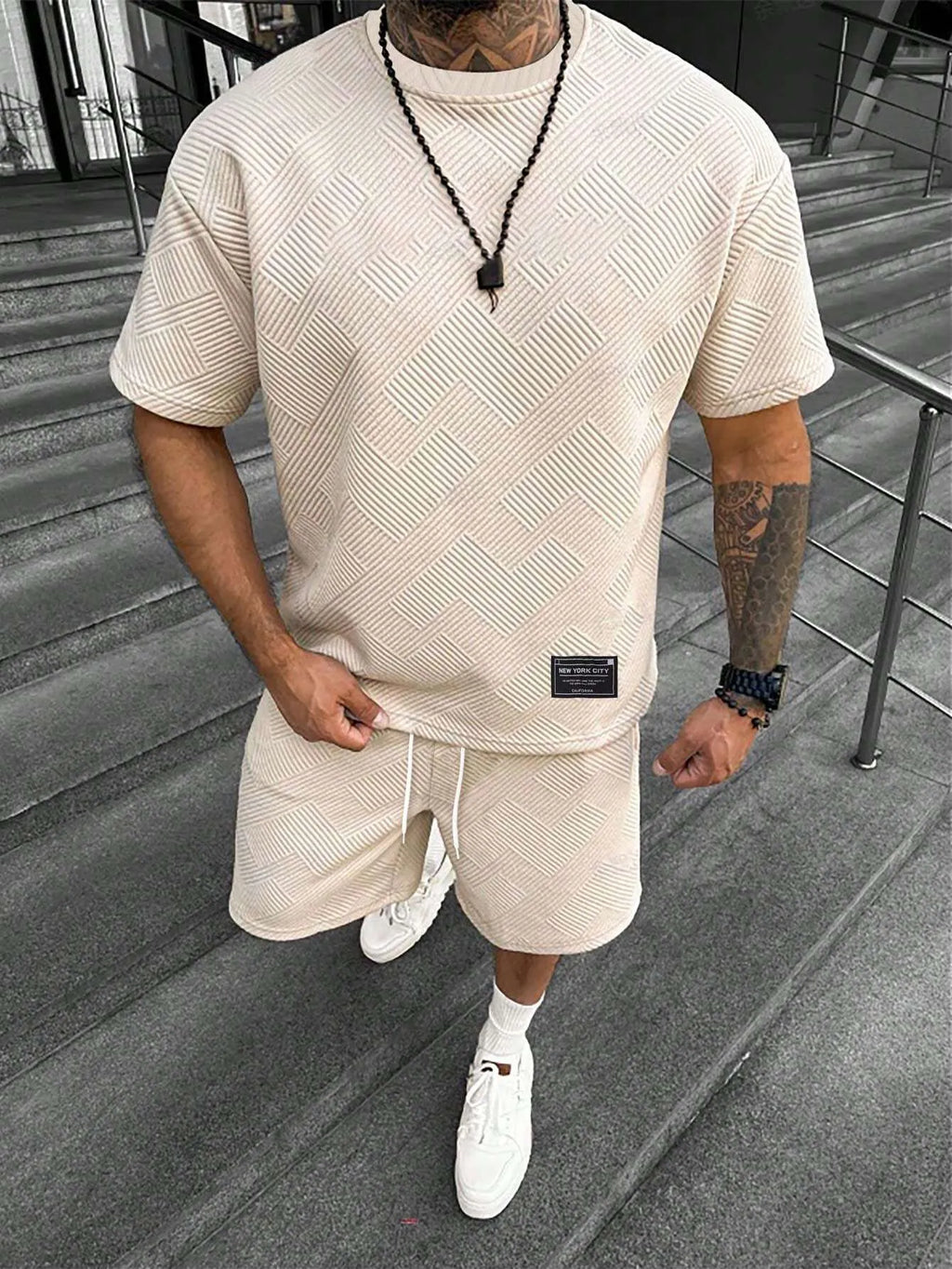 Men's short sleeve top and shorts suit in a polyester blend fabric on a mannequin