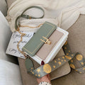 Women's wide strap crossbody bag in Matcha Green PU material with contrast colour details for leisure travel