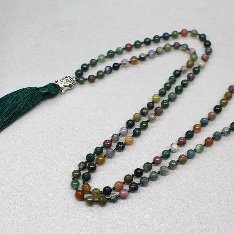 Natural agate bracelet with 108 geometric beads, each measuring 6mm, laid flat.