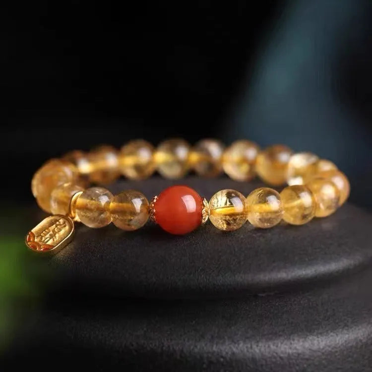 Polished red agate bead bracelet showing gold ruby colour, offered in 6mm, 8mm and 10mm bead sizes.