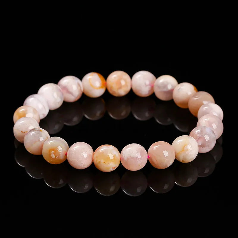 A sweet-style natural cherry agate bracelet with round geometric beads for women.
