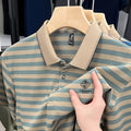 Man wearing a red striped short sleeve casual t-shirt with a mosaic pattern design.