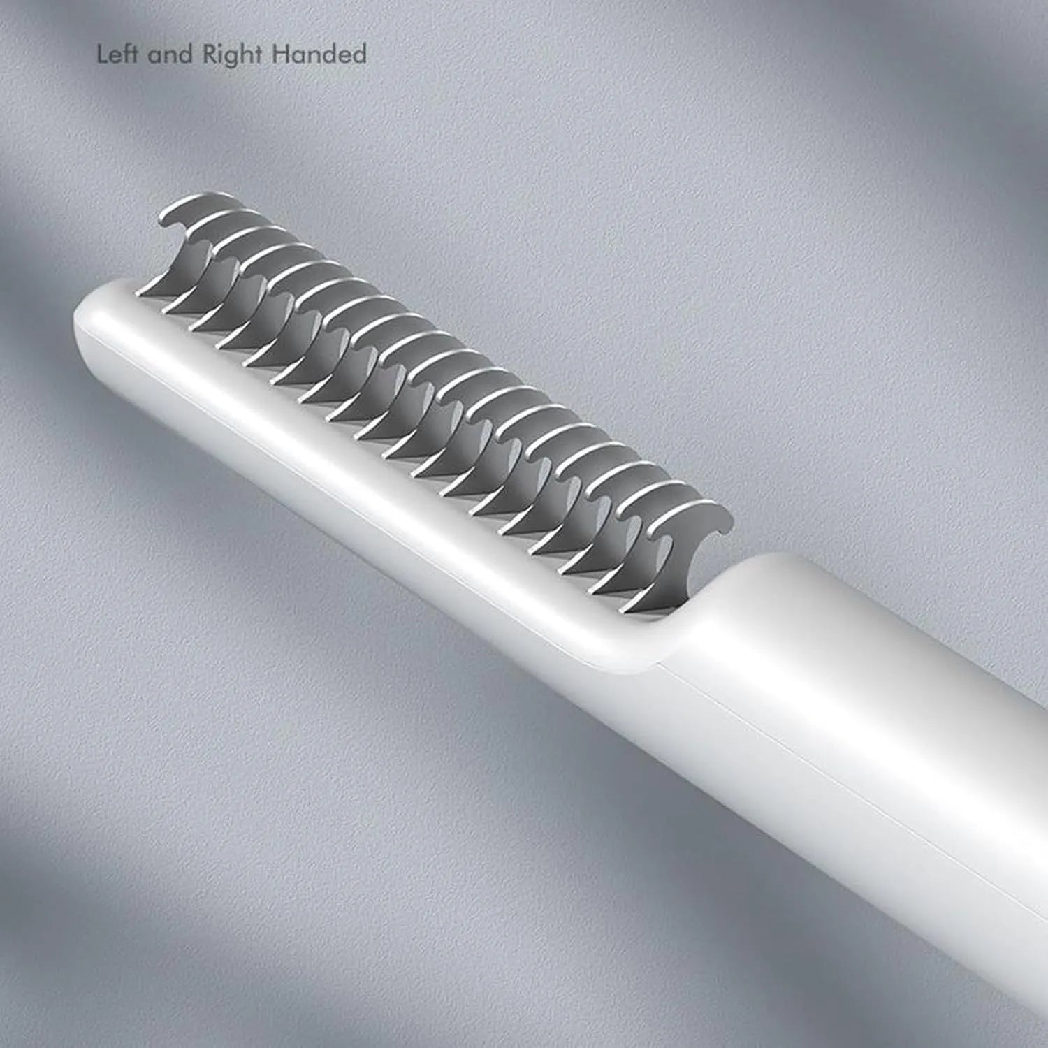 Stainless steel pet dematting comb with ergonomic handle for removing dog hair knots and mats.