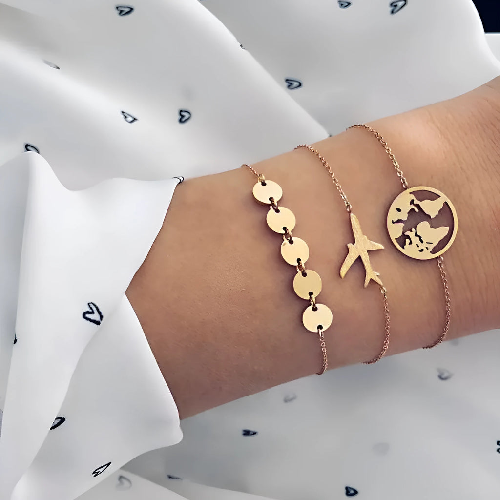 Three bohemian aircraft map charm bracelets with heart-shaped alloy charms in electroplated finish