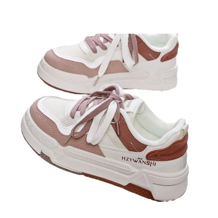 Beige children's board shoes with thick rubber soles, cross shoulder straps, and front laces on a synthetic leather upper.