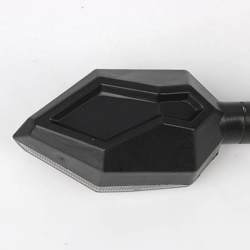 Arrow-shaped LED motorcycle direction indicator light with 12V yellow and coloured accent options.