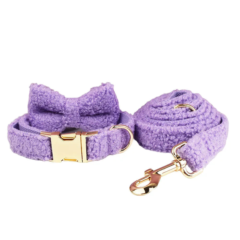 Purple four-piece dog accessory set showing cloth collar, leash, bow, and vest for small dogs