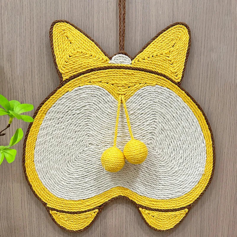Yellow corgi-butt design sisal cat scratching pad with anti-slip base on a wooden floor.