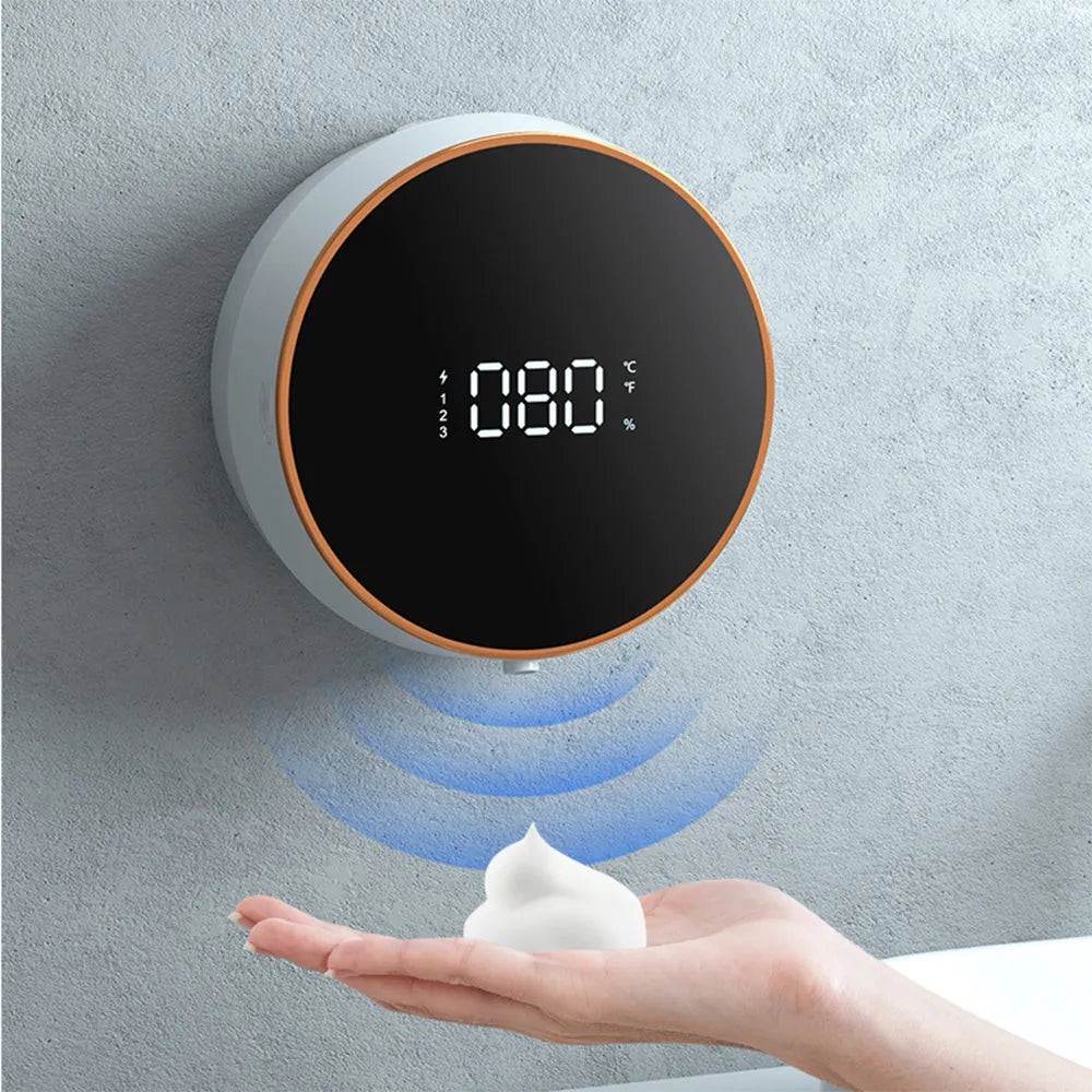Black automatic touchless foam soap dispenser with USB charging port mounted on bathroom wall