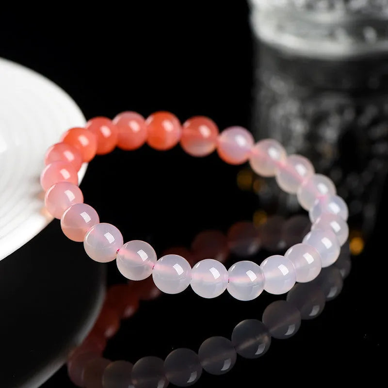 Yanyuan Agate bracelet with gradient salt source colour on wrist, showing geometry-shaped beads.