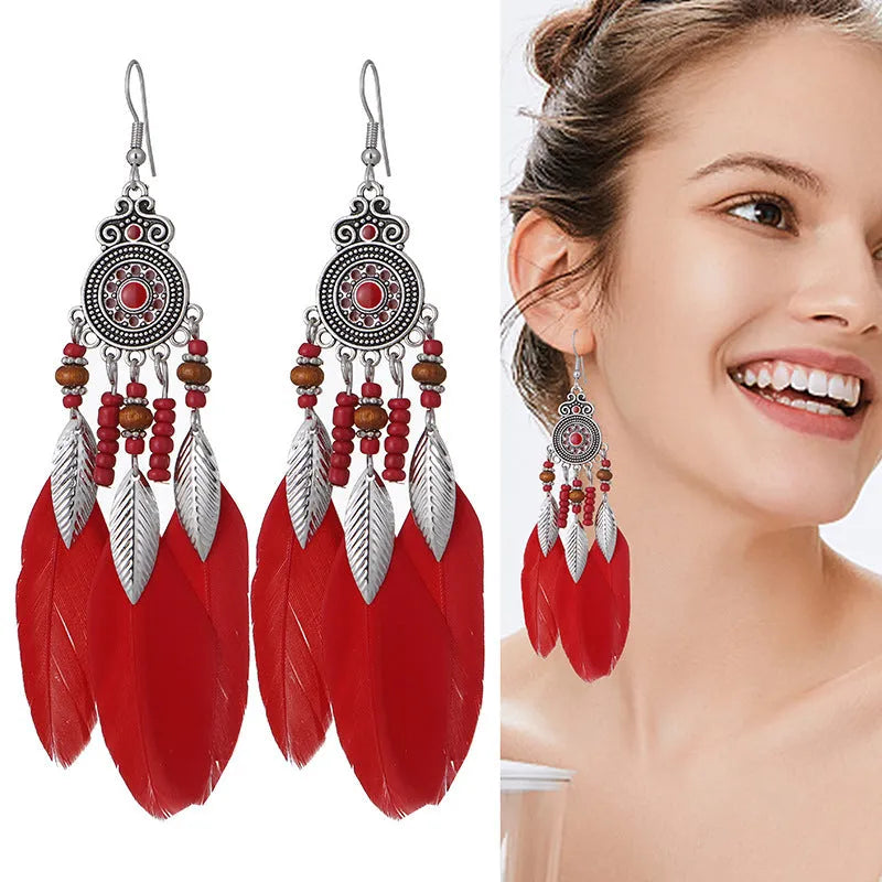 Feather earrings with round drop design in twelve bohemian colours including skin pink, light purple and mixed shades
