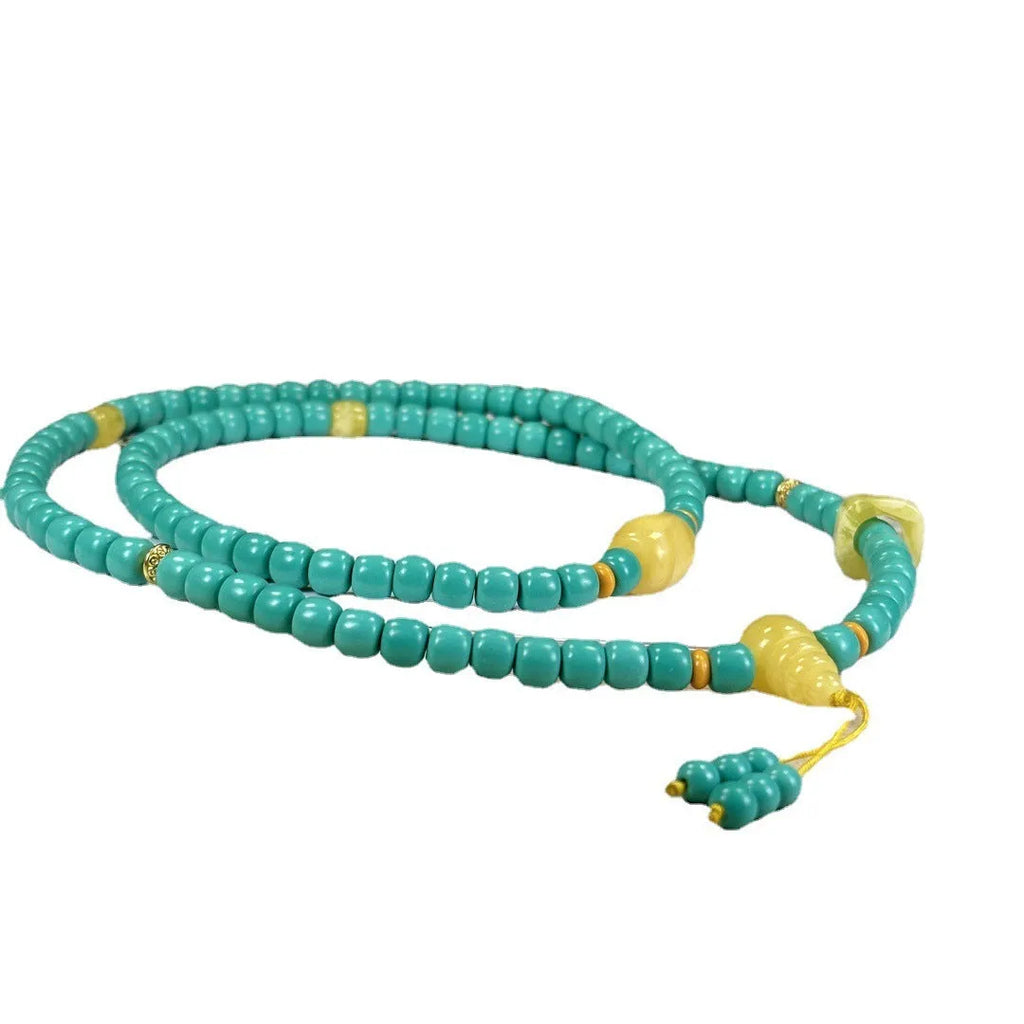 Turquoise hand-woven mesh flower lucky pendant on a long, adjustable ball bead necklace chain.