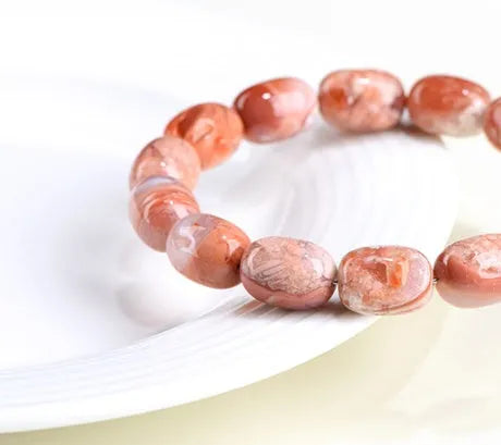 Natural cherry agate barrel bead bracelet with 10x14mm stones and Ruyi design elements