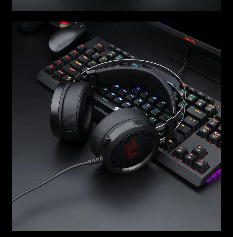 Black wired over-ear computer gaming headset with a 3.5mm jack and long cable.