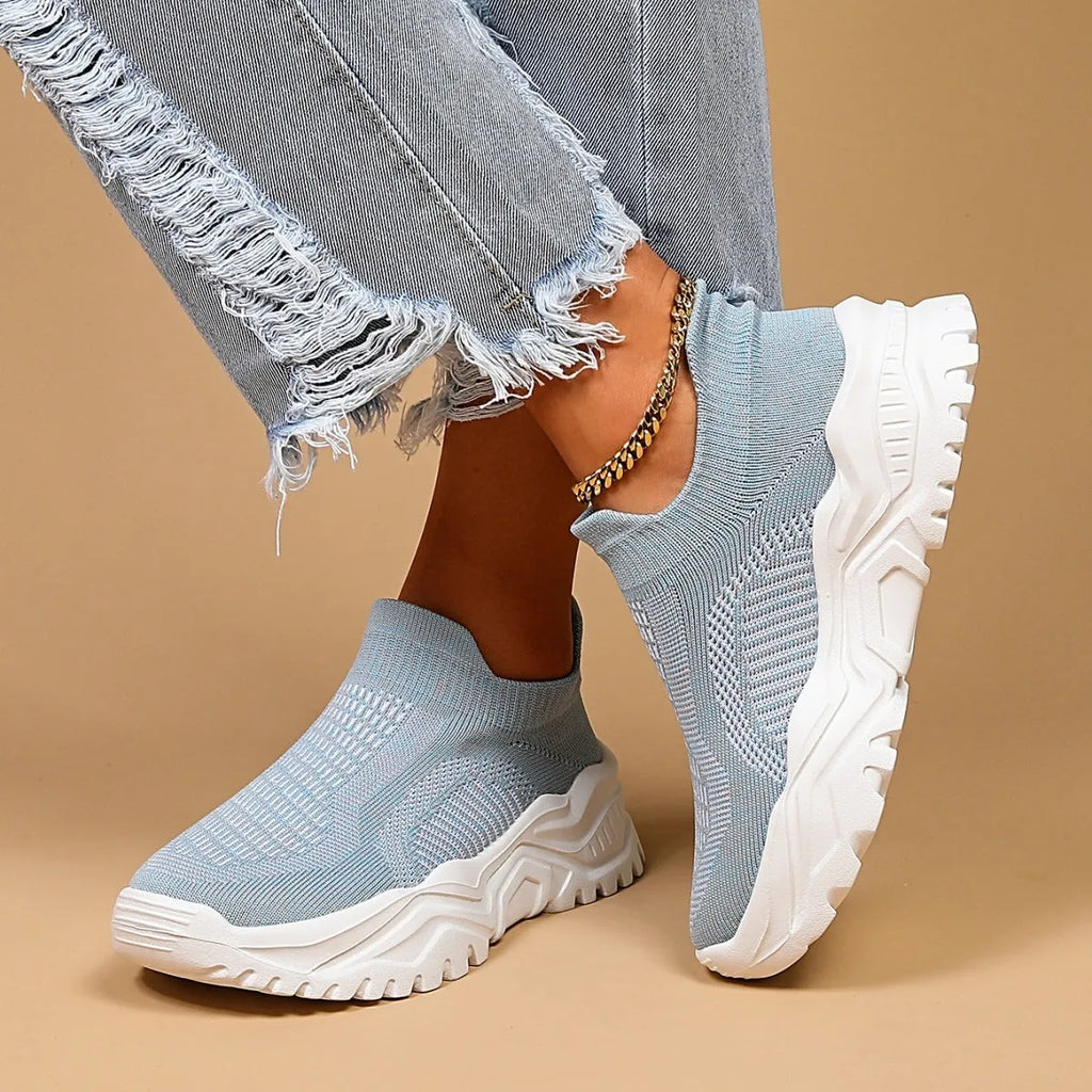 Light blue women's mesh slip-on sports shoes with woven upper and mid heel design