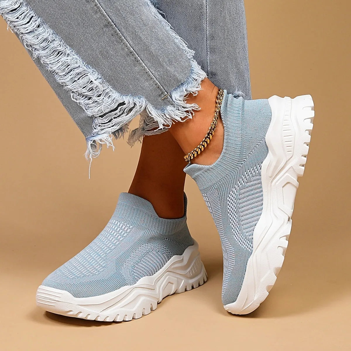 Light blue women's mesh slip-on sports shoes with woven upper and mid heel design