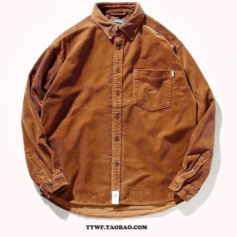 A caramel coloured corduroy loose shirt with long sleeves, shown in a cardigan style.
