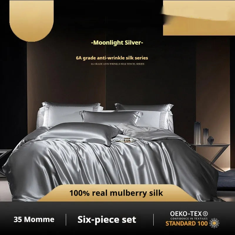 Silk four-piece quilt cover set in a solid colour shown on a bed, available in multiple sizes.