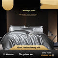 Silk four-piece quilt cover set in a solid colour shown on a bed, available in multiple sizes.