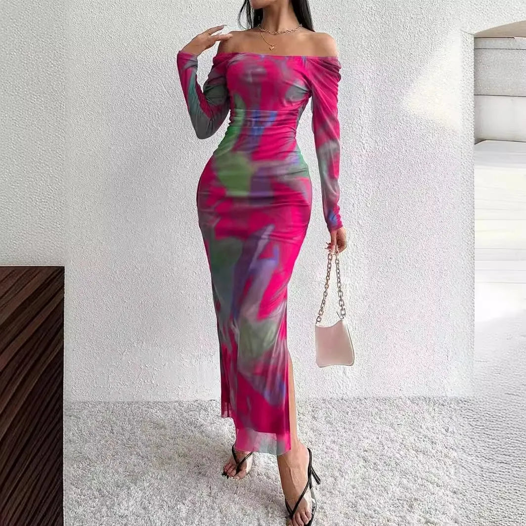 A long green mesh fishtail dress with a square collar, pleated detail, gradient colour, and a split hem.