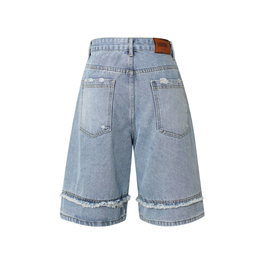 Men's distressed light blue denim shorts with raw edge detailing and a straight leg cut on a plain background.