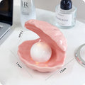 Yellow porcelain tray with a choice of pink or white decorative shell, some versions include a small integrated night light.