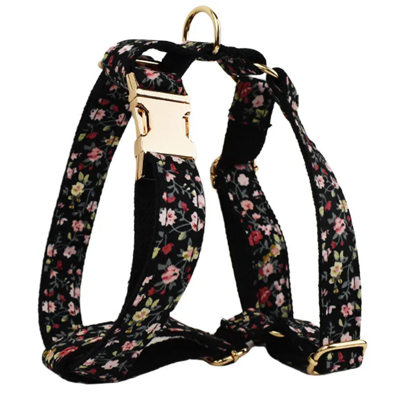 Four-piece pet accessory set showing dog collar, matching leash, decorative bow, and dog vest with cute printed lettering