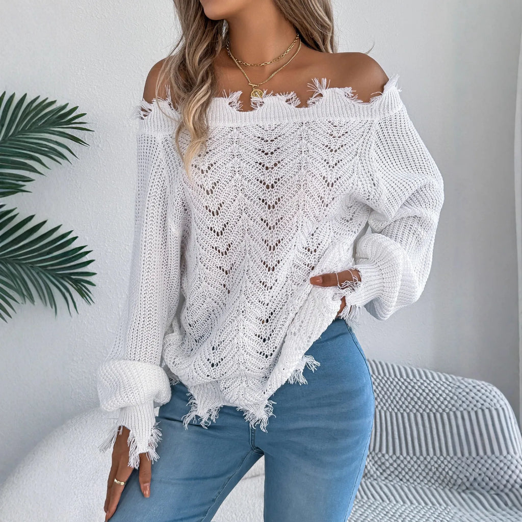 White women's off-the-shoulder pullover sweater with a hollow-out design and long sleeves.